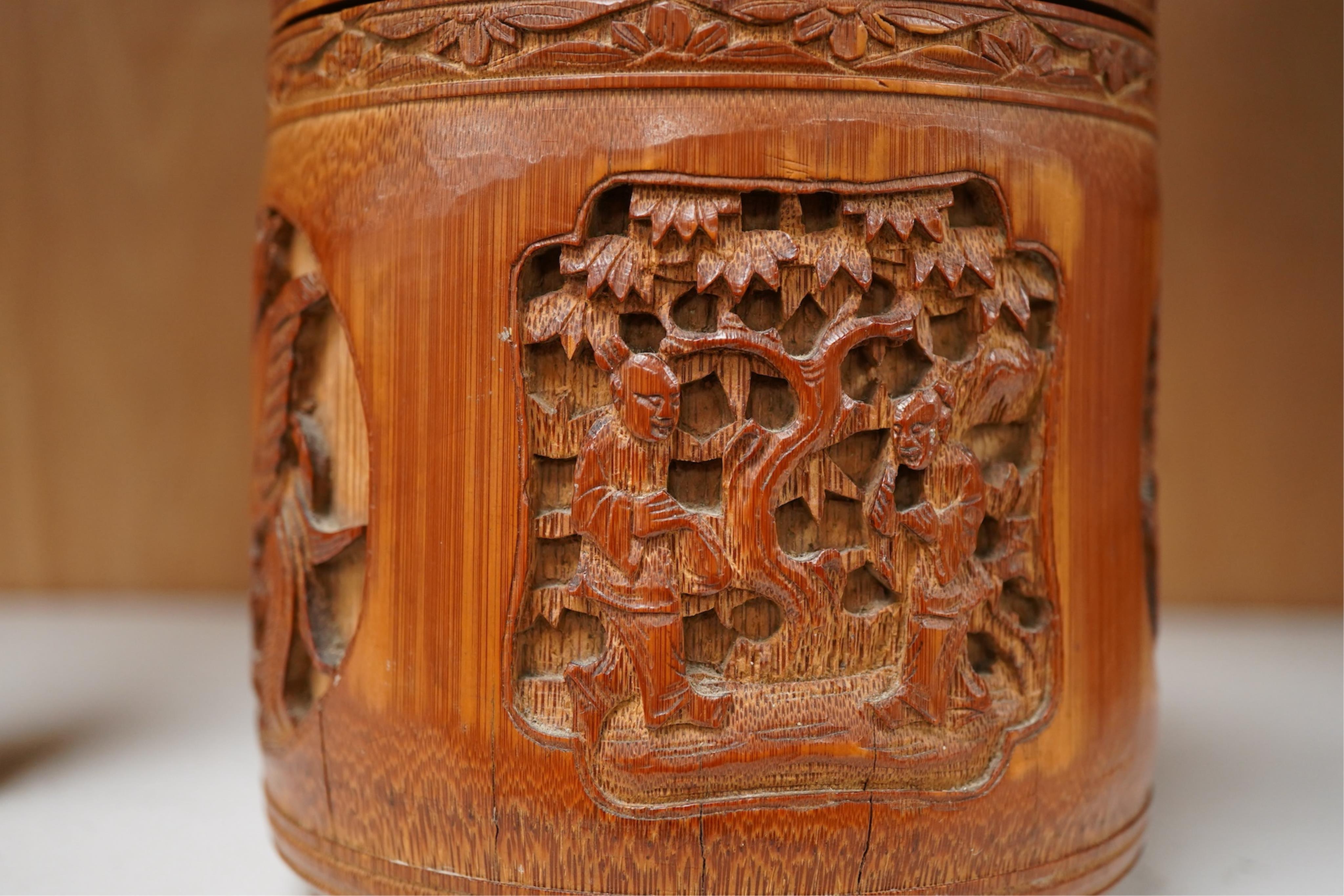 A Chinese carved bamboo tobacco jar and cover, 15cm high